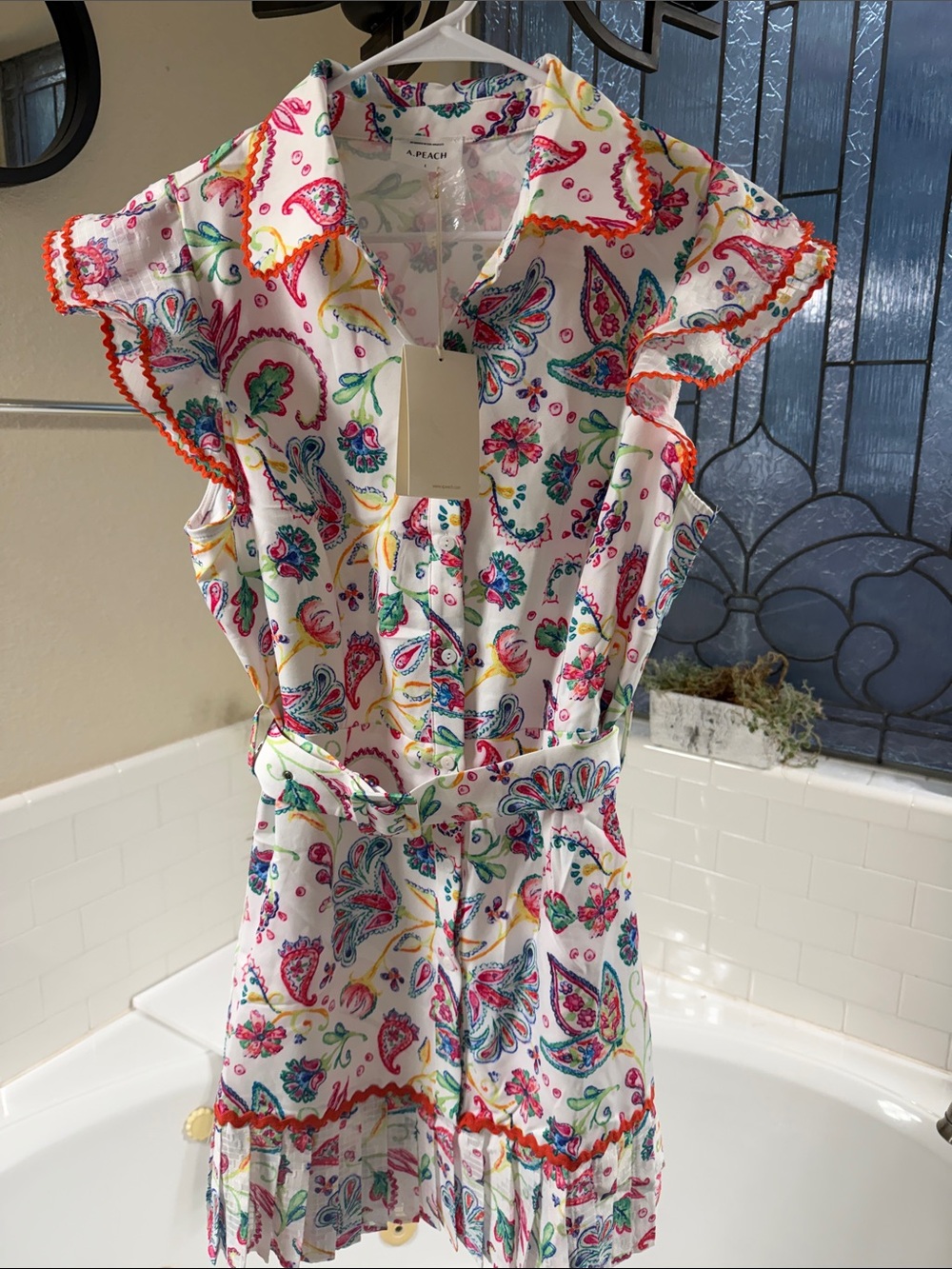 A. Peach Dress . Amazing dress in Large but fits more like a Med. MEW with tags